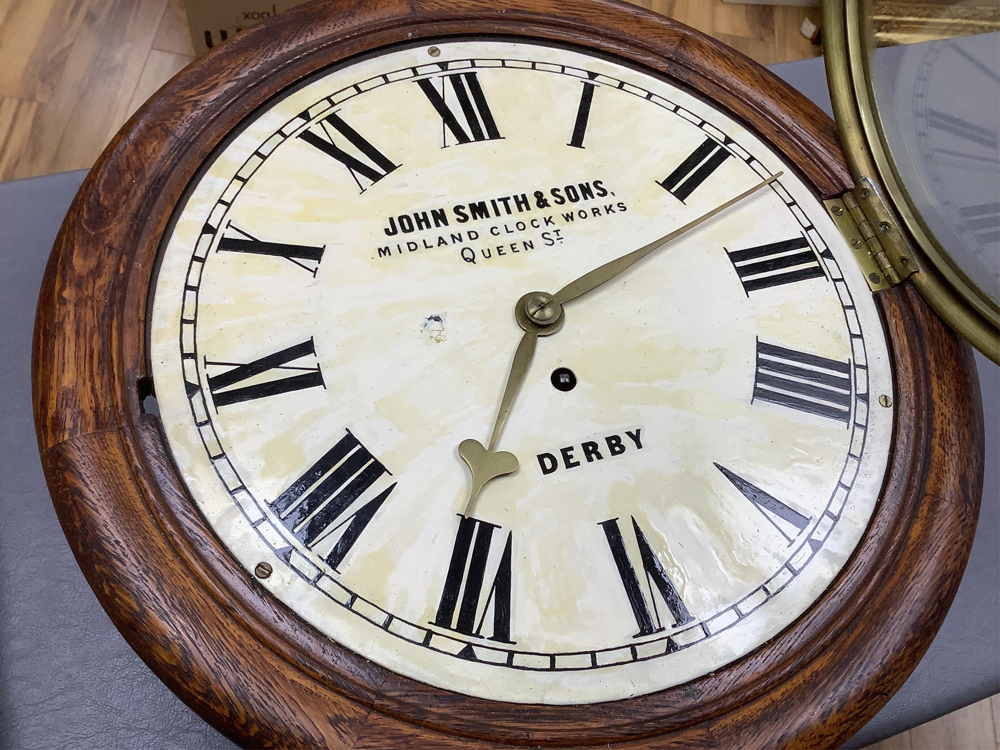 A John Smith & Sons of Derby oak wall clock, 39cm